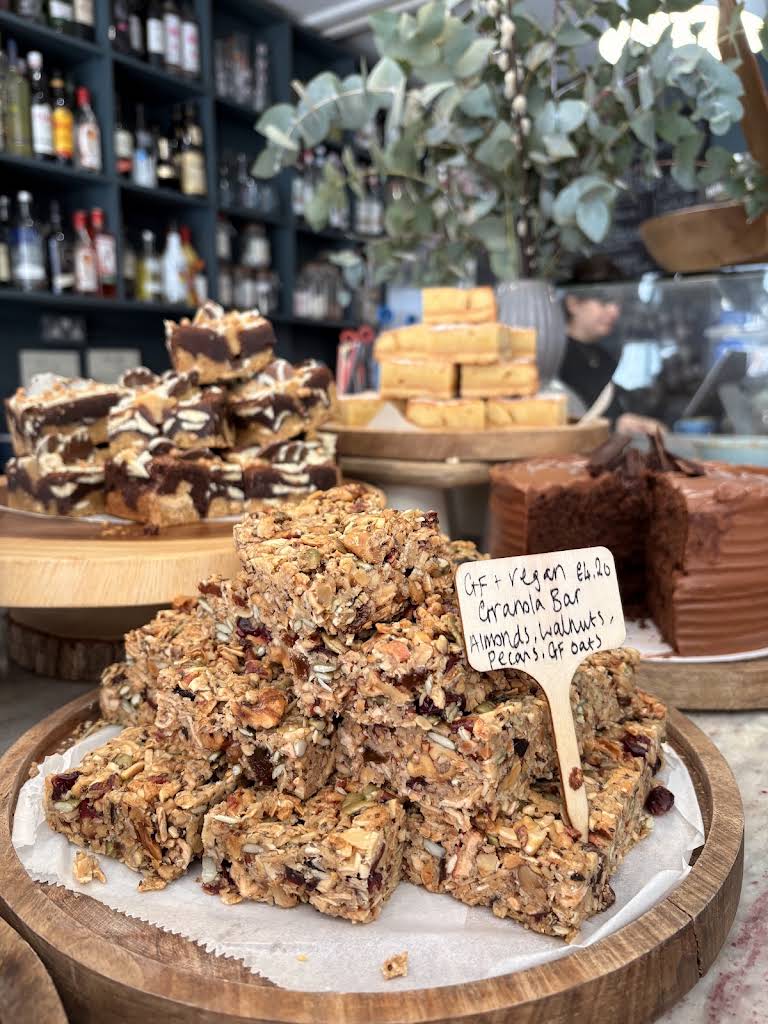 General Store Winchester's cake counter, with trays of cake and stacked bars